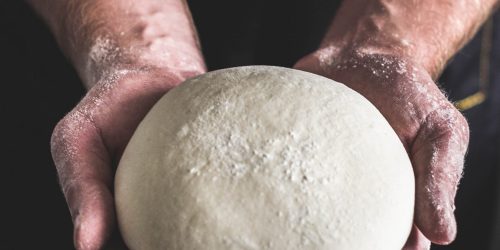artur-rutkowski-4yzEtTQLdL4-unsplash person holding dough