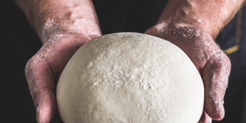 artur-rutkowski-4yzEtTQLdL4-unsplash person holding dough
