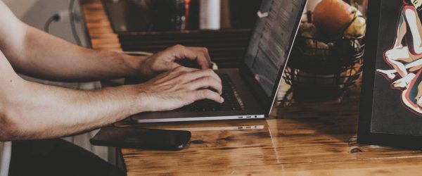 person-in-front-of-laptop-on-brown-wooden-table-2115217 (1) person-in-front-of-laptop-on-brown-wooden-table-2115217 (1)